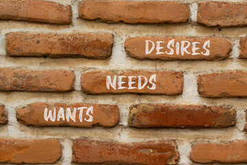 Wants needs and desires symbol. Concept words Wants Needs Desires on red bricks on a beautiful brick wall background. Business wants needs desires concept. Copy space.