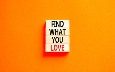 Find what you love symbol. Concept words Find what you love on wooden blocks. Beautiful orange...