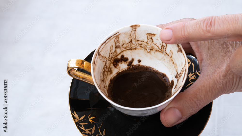 Wall mural fortune telling with coffee. woman fortune teller predicting the future with coffee grounds