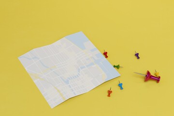 the map and the stationery buttons next to it on a yellow background for marking the destination. 3D render