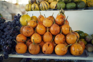sweet granadillas at a market in Peru. 