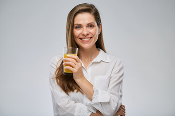 Smiling woman holding orange juice glass. Isolated female advertising portrait.