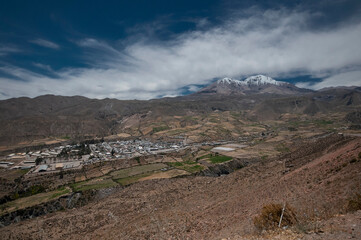 view from the mountains to a highland town