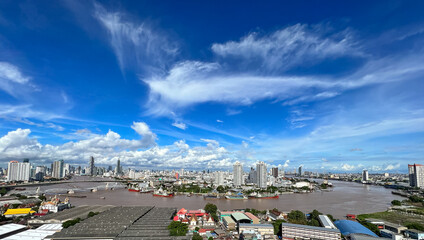 Aerial view Chao Phraya of Bangkok skyline and skyscraper with light trails on Sathorn Road center...