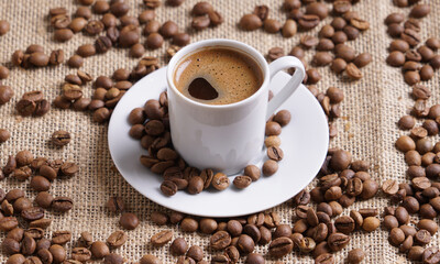 Turkish coffee with coffee beans on a brown background