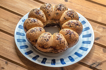 home baked nut cake on a porcelain plate on a wooden table