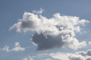 Fototapeta na wymiar Powerfully cumulus white clouds against a blue sky.