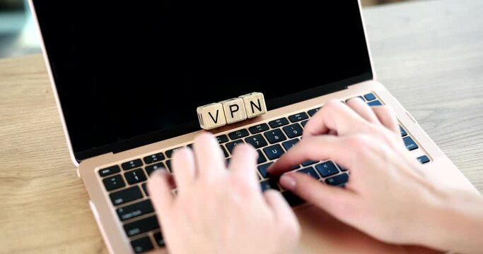 Woman typing laptop with vpn app creating internet protocols to secure private network