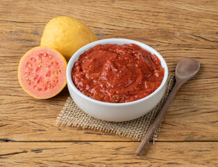 Goiabada, traditional brazilian creamy guava sweet with fruits over wooden table