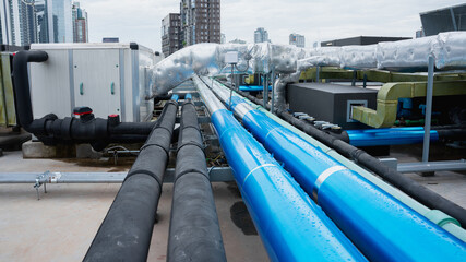 On the roof, there are several pipes for the air conditioning system.