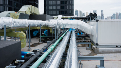 On the roof, there are several pipes for the air conditioning system.