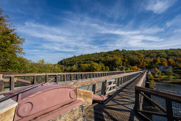 Historic Roebling Bridge also known as Roebling's Delaware Aqueduct over the Delaware River on a brilliant fall morning