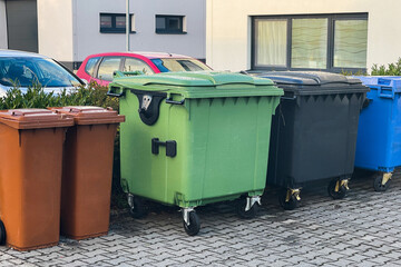garbage sorting. colorful trash cans in the backyard