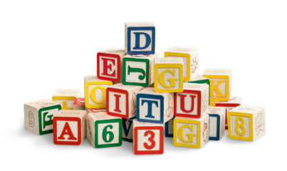 Colorful toy blocks with letters on white background