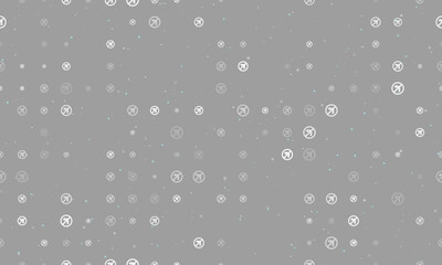 Seamless background pattern of evenly spaced white no left turn signs of different sizes and opacity. Vector illustration on gray background with stars
