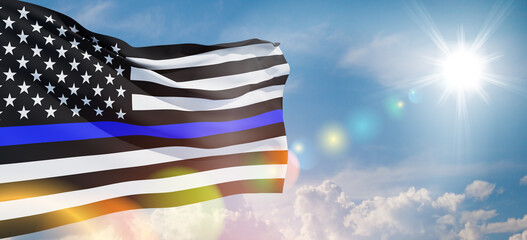 American flag with police support symbol Thin blue line on blue sky. American police in society as...