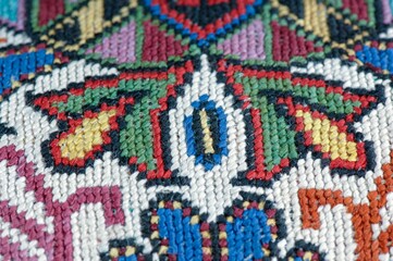 Closeup shot of national ornaments and patterns of Central Asia on a piece of cloth