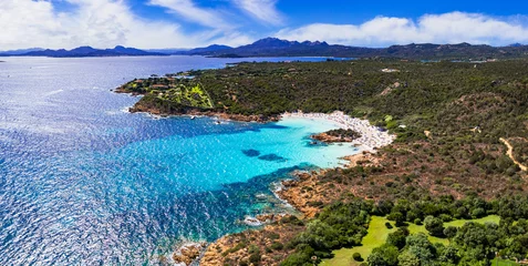 Poster Italy summer holidyas . Sardegna island - stunning Emerald coast (Costa Smeralda) with  beautiful beaches. aerial view of popular Capriccioli beach © Freesurf