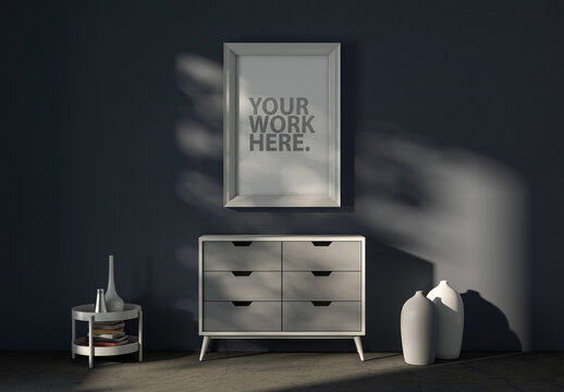White Poster Frame Mockup Hanging Over a Modern Chest in a Room