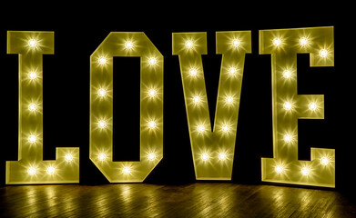Illuminated letters spelling the word LOVE. Concept for Valentines day, wedding
