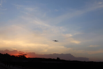Small plane against the background of the twilight sky