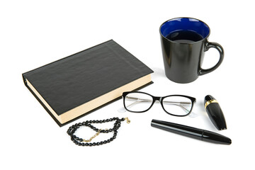 Book, cup of coffee, glasses, cosmetics and beads isolated on white background.