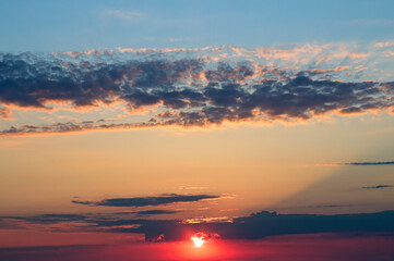 Beautiful sky with bright sunset (sunrise) and clouds.