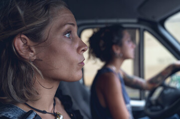 Two sisters, driving a van.