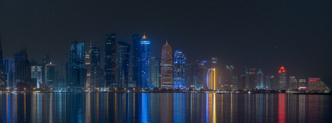 Doha Skyline during night with many colorful towers