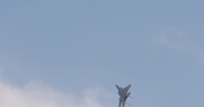 F-15 fighter jet maneuvering during an airshow
