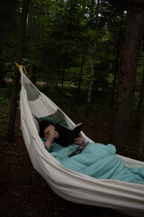 person reading in hammock