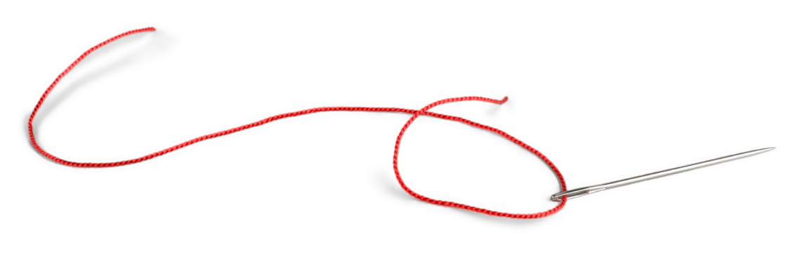Red thread and needle isolated on white background