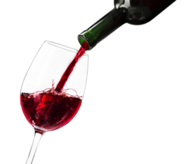 Pouring red wine in a glass on n background