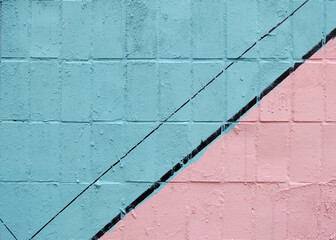 Colorful painted tile wall (blue, pink and black) as background or texture