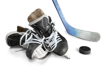 Pair of hockey skates with Hockey stick and puck isolated on white background - obrazy, fototapety, plakaty