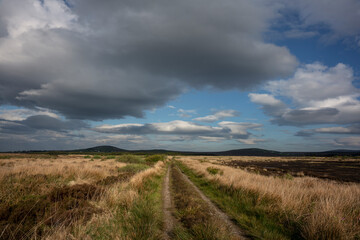 Obraz premium The vast country of Bangor Erris Bog, County Mayo, Ireland. Dark clouds are gathering, rain is coming.