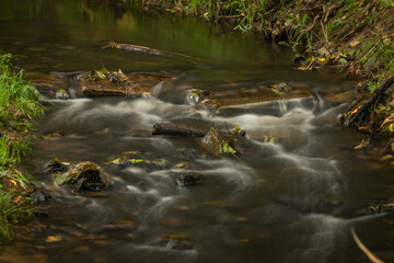 Mnichovsky creek near Mnichov and Sitiny villages in autumn dark cloudy morning