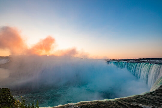 Sunrise over Horseshoe Falls closeup in the morning with mist at Niagara Falls in Canada