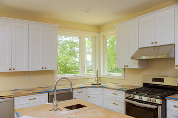 Installation kitchen cabinets with beautiful furniture such as drawers in new house