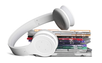 Headphones and compact discs  isolated   on background
