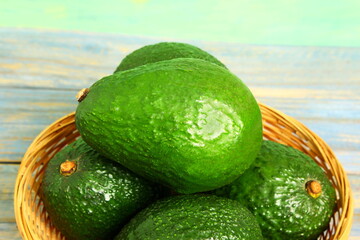 Fresh organic avocado isolated closeup in basket  