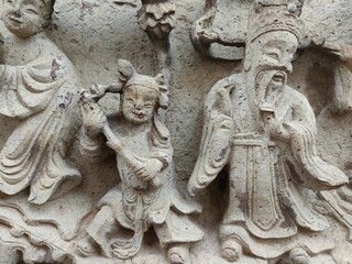 Chinese gods carved on stone
