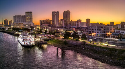 Fototapeta na wymiar New Orleans River Paddle boat at sunset
