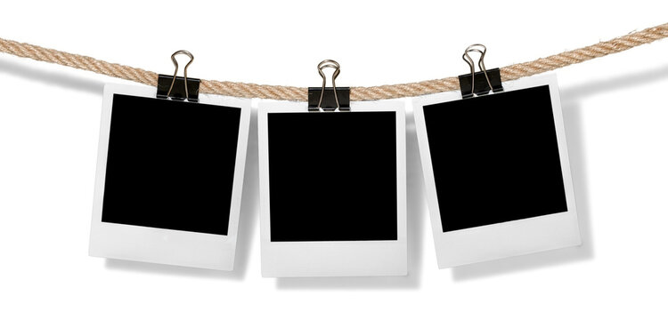 Hanging instant photo frames isolated on white