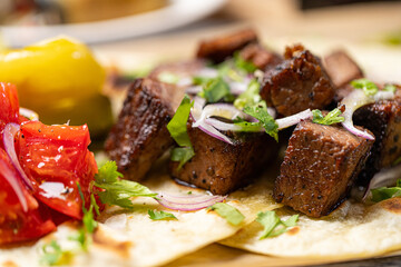 pork skewers with pickles in a restaurant
