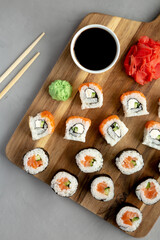 Homemade Sushi Platter with Wasabi and Soy Sauce on a Board, top view. Flat lay, overhead, from above.