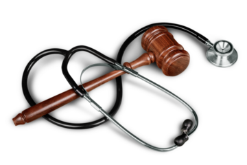 Gavel and stethoscope  on background, symbol photo for bungling and medical error