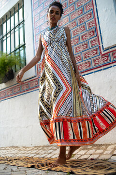 Camera aware full body portrait of Africa Gen Z young woman