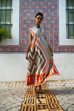 Confident elegant woman walking in splendid silk long dress