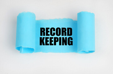 On a white surface, a blue scroll of paper with the inscription - Record keeping